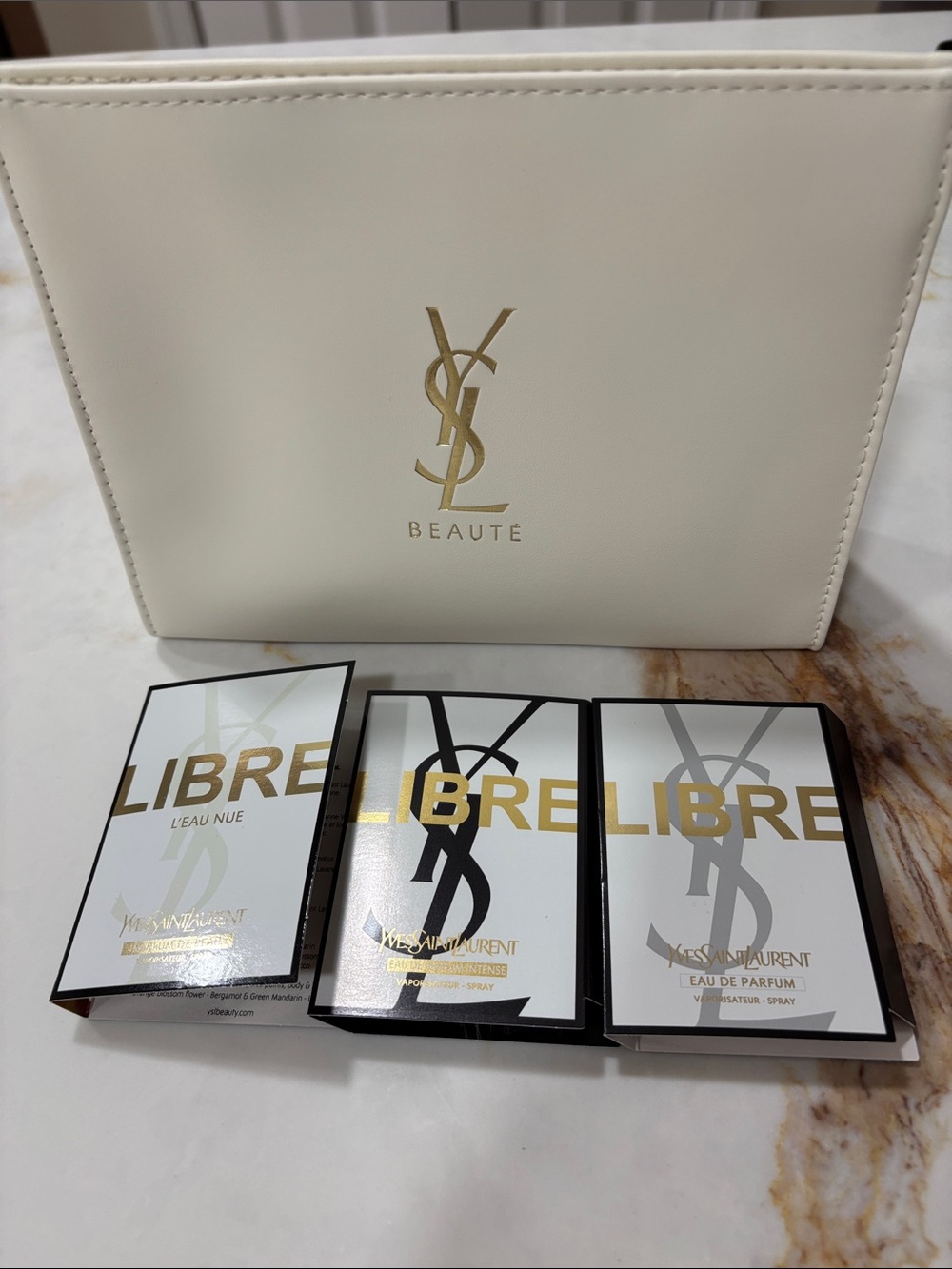 Yves Saint Laurent White and Gold Toiletry Pouch with Libre Sample Pack